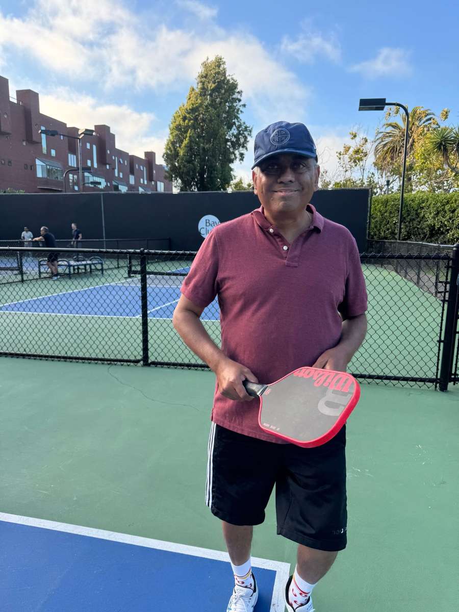 Shri Shrivas on court with a paddle